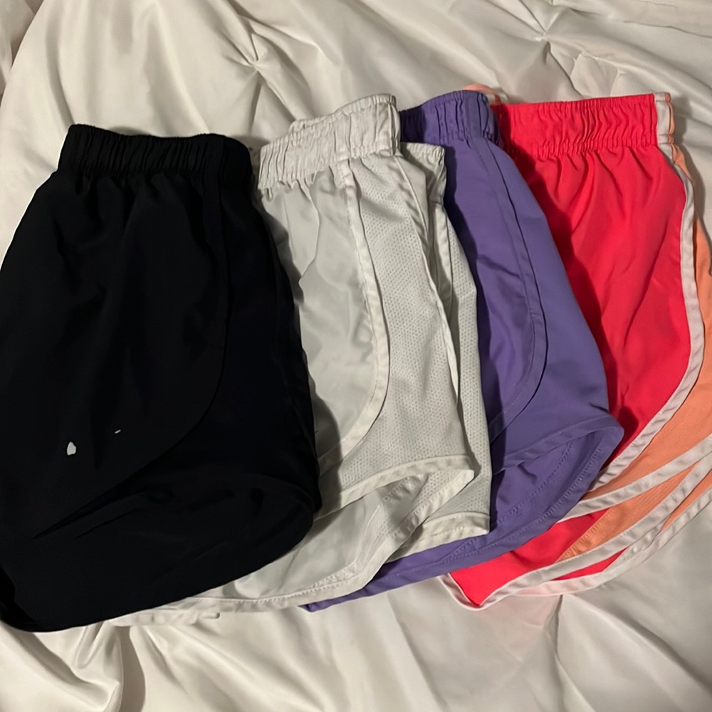 4 Pairs of Nike Running Shorts